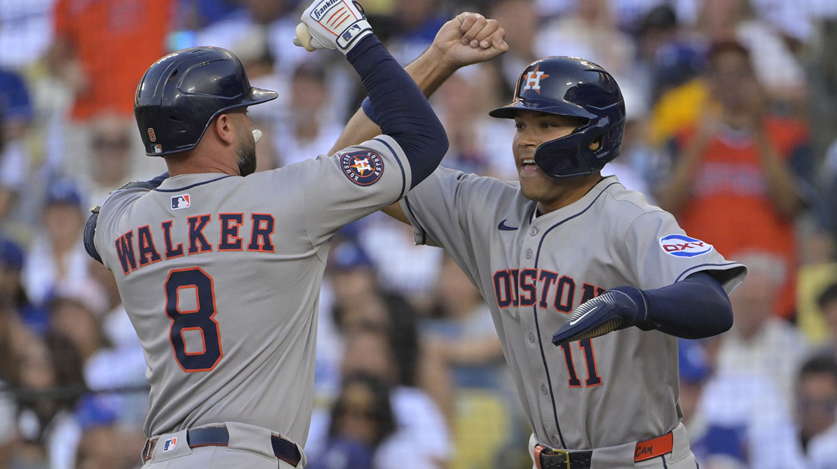 Houston Astros first base Christian Walker (8) celebrates a two run home run with outfielder Cam Smith (11) during the third inning against the Los Angeles Dodgers at Dodger Stadium.