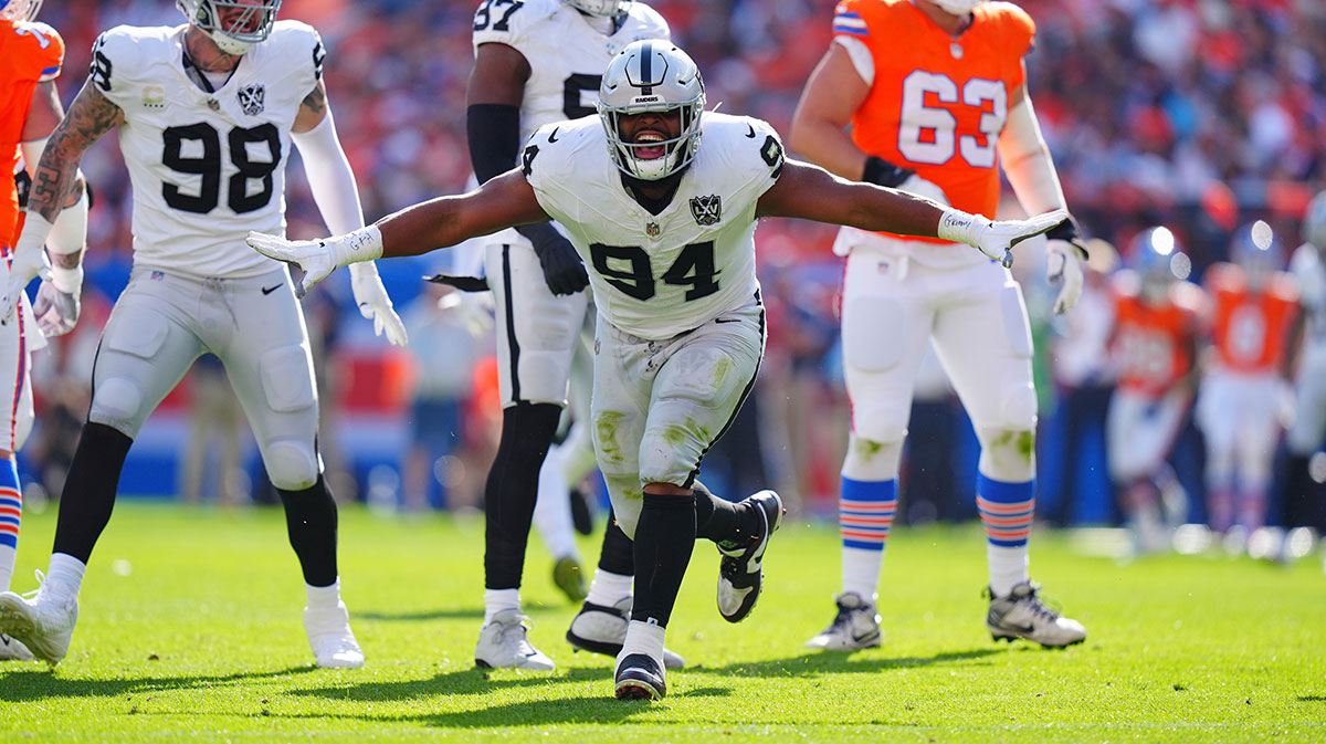 Las Vegas Raiders defensive tackle Christian Wilkins (94) celebrates his sack in the second quarter against the Denver Broncos at Empower Field at Mile High.