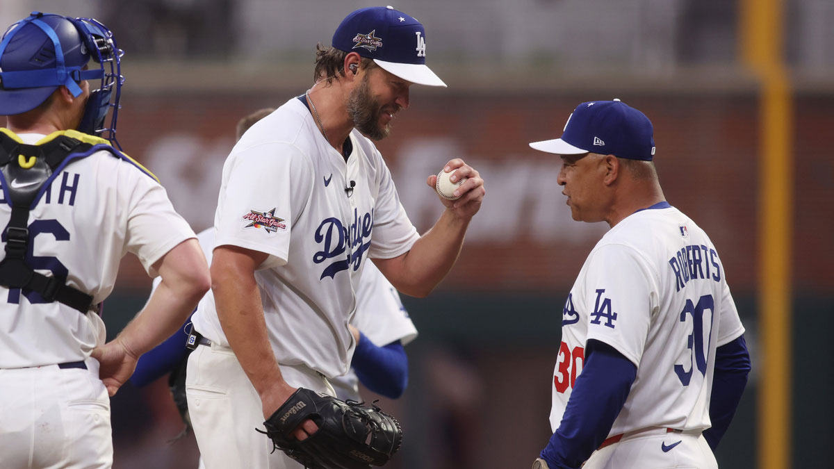 National League pitcher Clayton Kershaw (22) of the Los Angeles Dodgers reacts with manager Dave Roberts of the Los Angeles Dodgers in the second inning against the American League during the 2025 MLB All Star Game at Truist Park.