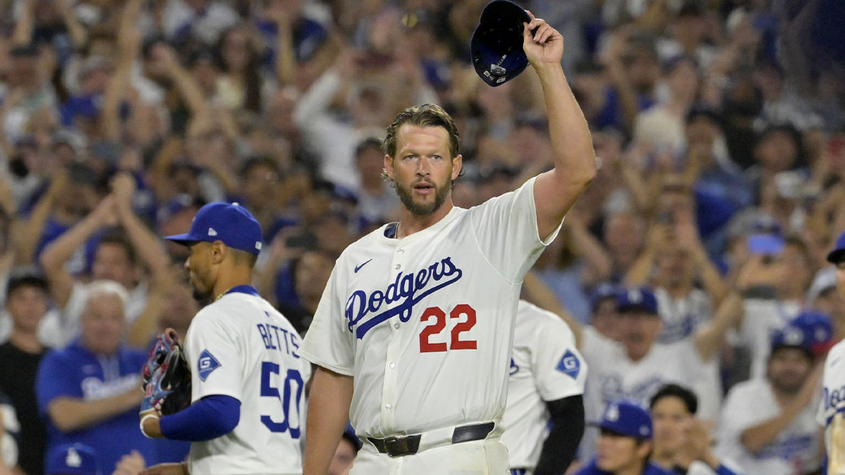 Los Angeles Dodgers starting pitcher Clayton Kershaw (22) acknowledges the crowd after striking out Chicago White Sox third baseman Vinny Capra (41) for his 3000th career strike in the fifth inning at Dodger Stadium.