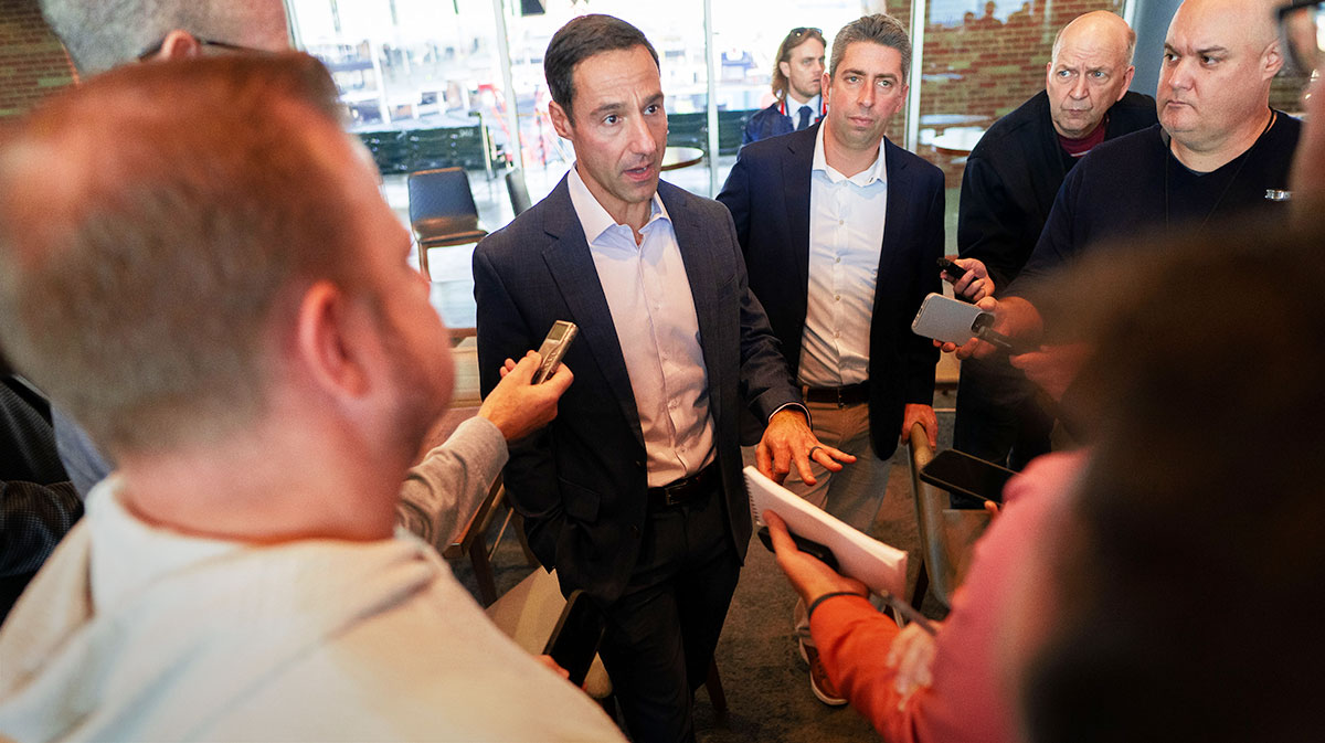 Cleveland Guardians president of baseball operations Chris Antonetti, middle, talks to the media during an introductory press conference for new manager Stephen Vogt at Progressive Field.
