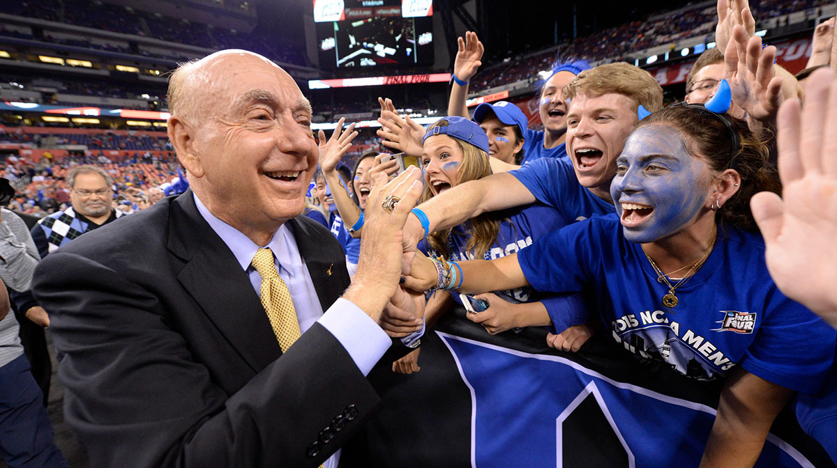 Dick Vitale of ESPN high fives Duke Blue Devils fans prior to facing the Wisconsin Badgers in the 2015 NCAA Men's Division I Championship game at Lucas Oil Stadium.