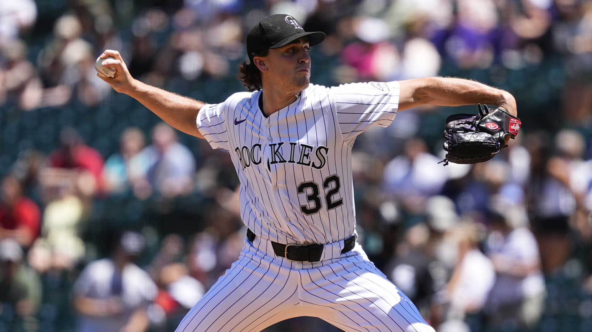 Colorado Rockies starting pitcher Chase Dollander (32) throws a pitch in the first inning against the Chicago White Sox at Coors Field.