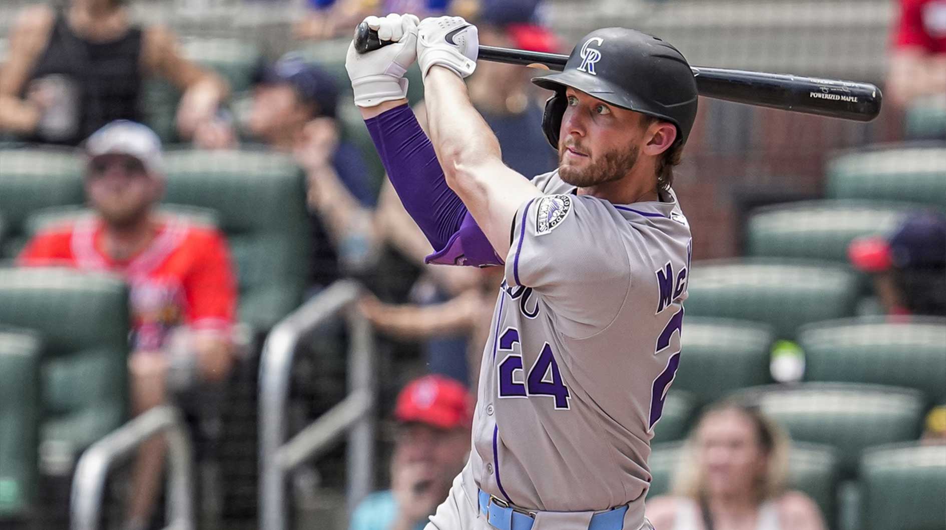 Colorado Rockies third baseman Ryan McMahon (24) hits a home run against the Atlanta Braves during the seventh inning at Truist Park.