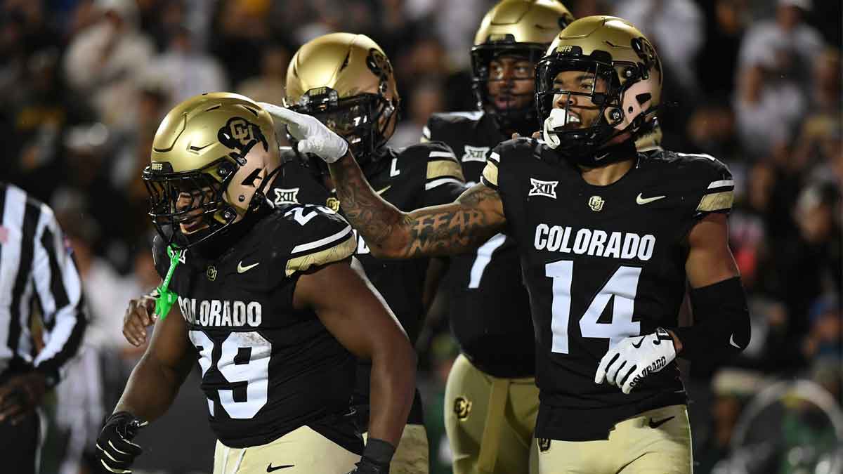 Colorado Buffaloes running back Micah Welch (29) celebrates with teammates after scoring during the second half against the Baylor Bears at Folsom Field.