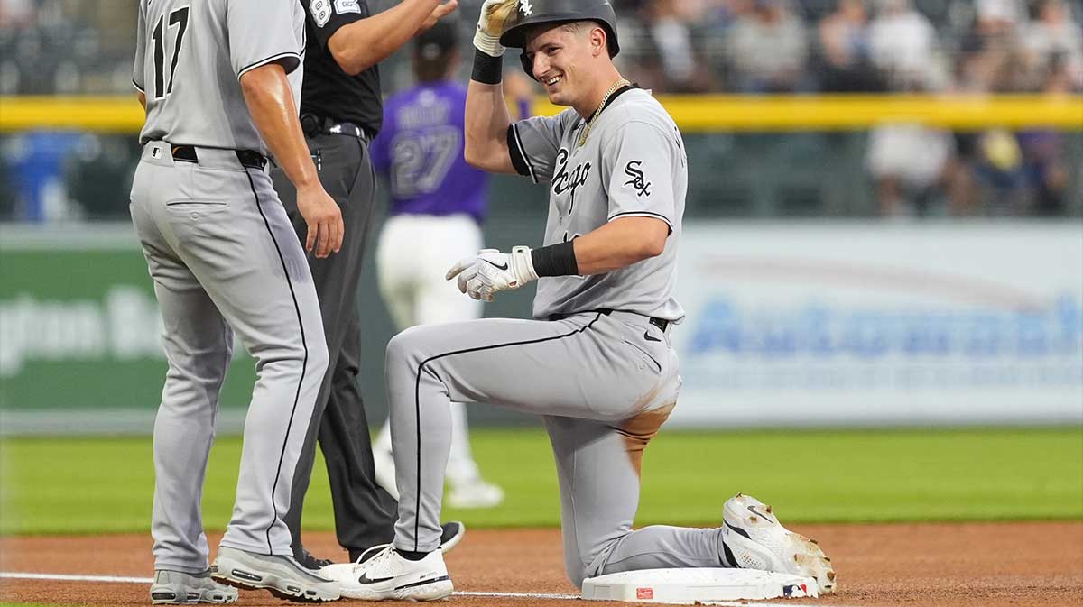 Jul 5, 2025; Denver, Colorado, USA; Chicago White Sox shortstop Colson Montgomery (12) triples in the first inning against the Colorado Rockies at Coors Field.
