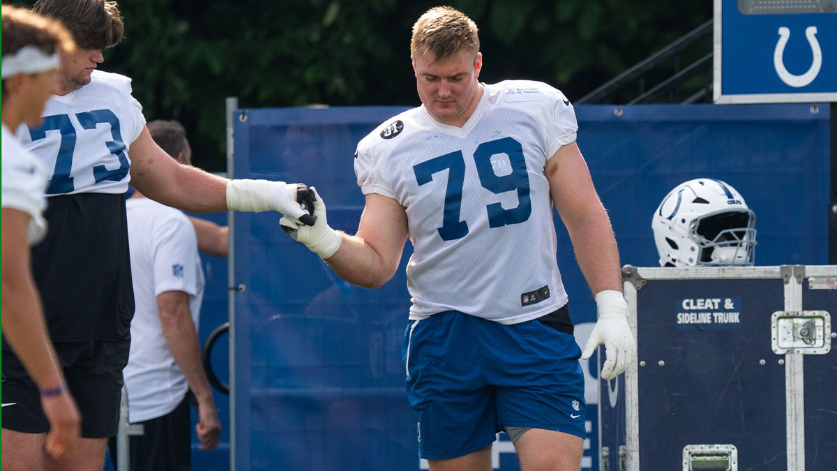 Indianapolis Colts offensive tackle Bernhard Raimann (79) gets a five from fellow offensive tackle Blake Freeland (73) on Friday, July 25, 2025, during training camp held at Grand Park in Westfield.