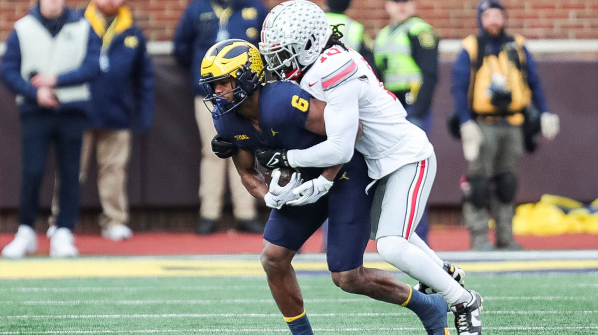 Michigan wide receiver Cornelius Johnson (6) makes a catch against Ohio State cornerback Denzel Burke (10) during the second half at Michigan Stadium