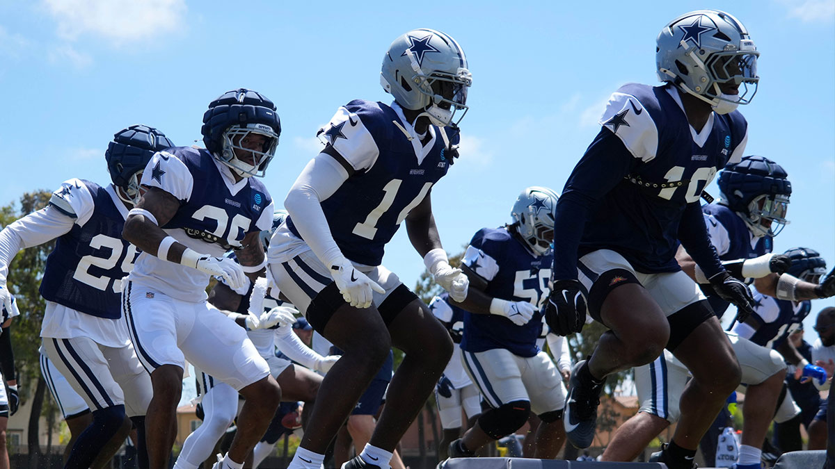 Dallas Cowboys defensive players run drills at training camp at the River Ridge Fields.