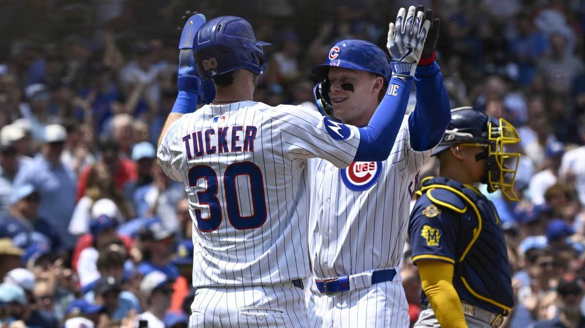 Jun 19 , 2025; Chicago, Illinois, USA; Chicago Cubs outfielder Pete Crow-Armstrong (4) high fives Kyle Tucker (30) after they score on his two-run home run against the Milwaukee Brewers during the first inning at Wrigley Field. Mandatory Credit: Matt Marton-Imagn Images