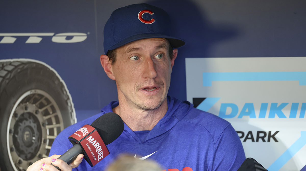 Chicago Cubs manager Craig Counsell (11) is interviewed in the dugout before the game against the Houston Astros at Daikin Park.