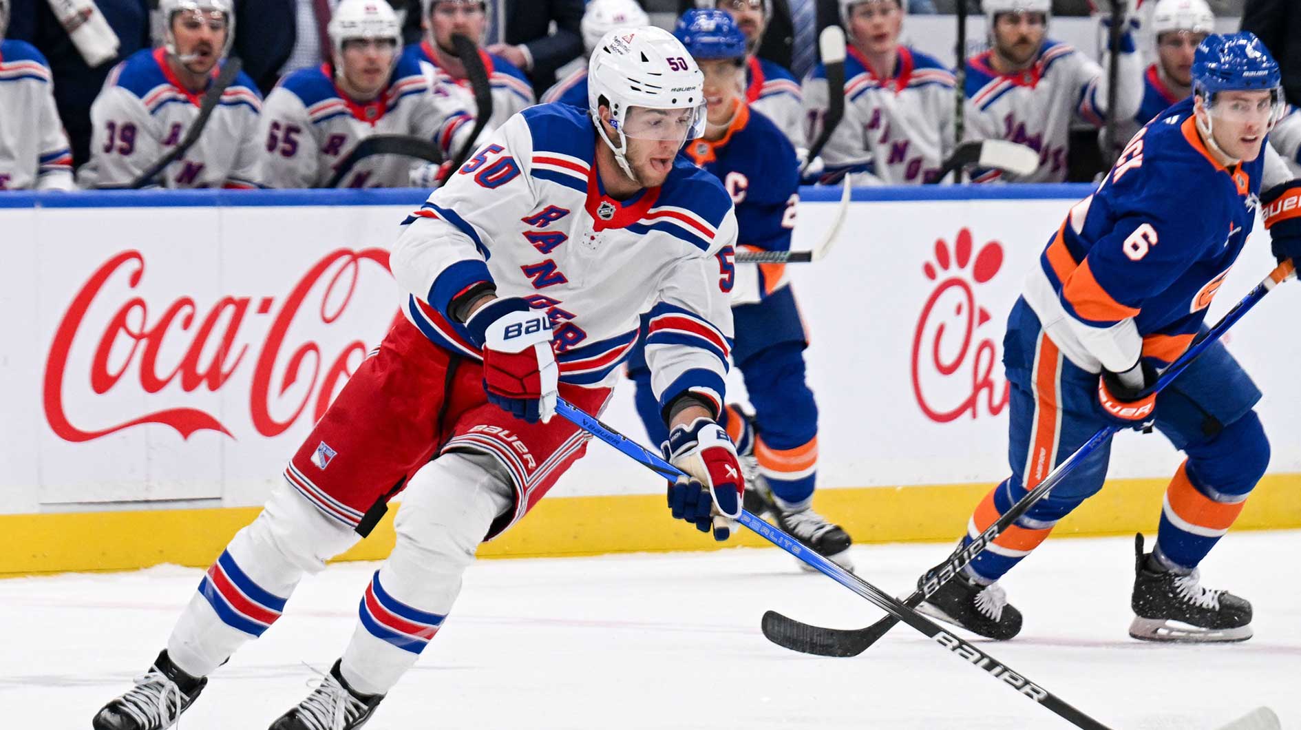 New York Rangers left wing Will Cuylle (50) skates across the blue line against the New York Islanders during the first period at UBS Arena.