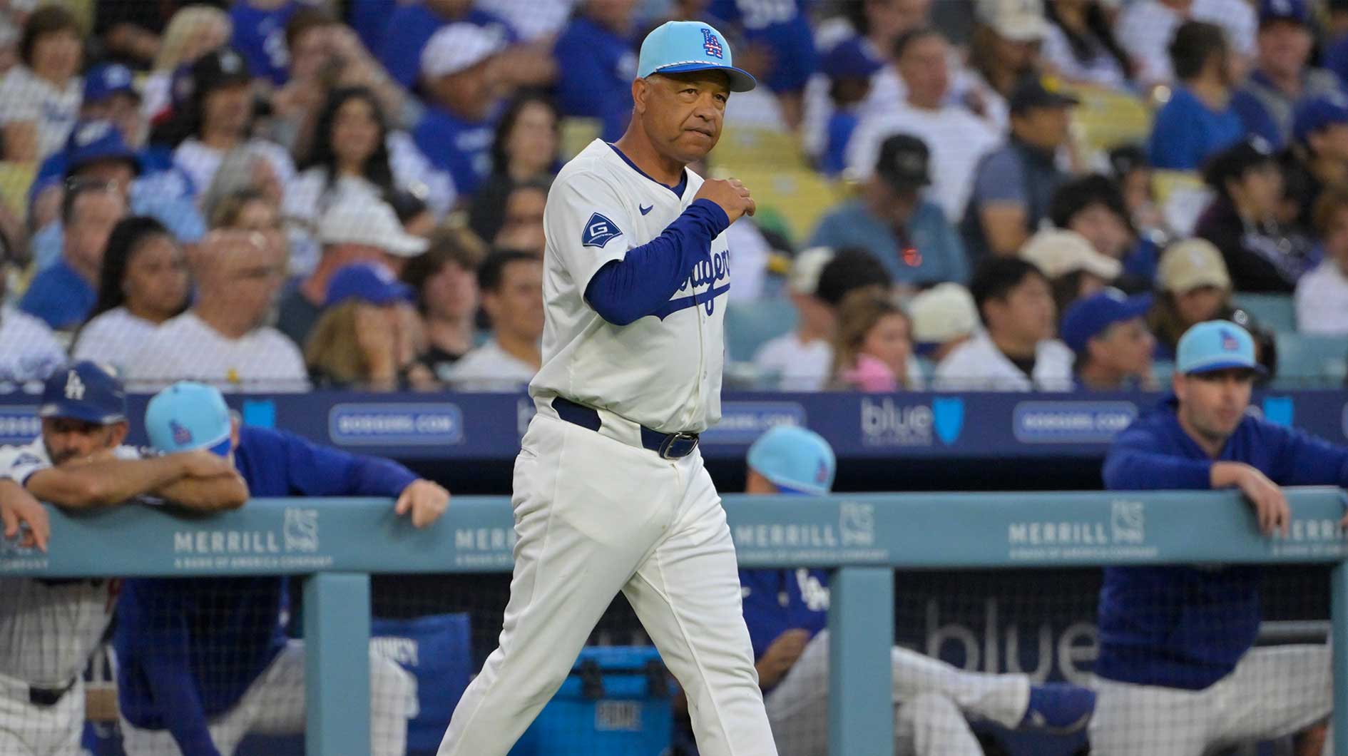 Los Angeles Dodgers manager Dave Roberts (30) walks to the moud for a pitching change during the sixth inning against the Houston Astros at Dodger Stadium.