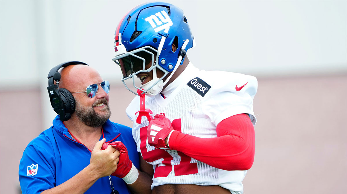 Giants Head Coach, Brian Daboll is shown beside New York Giants linebacker Abdul Carter (51), Sunday, July 27, 2025, in East Rutherford.
