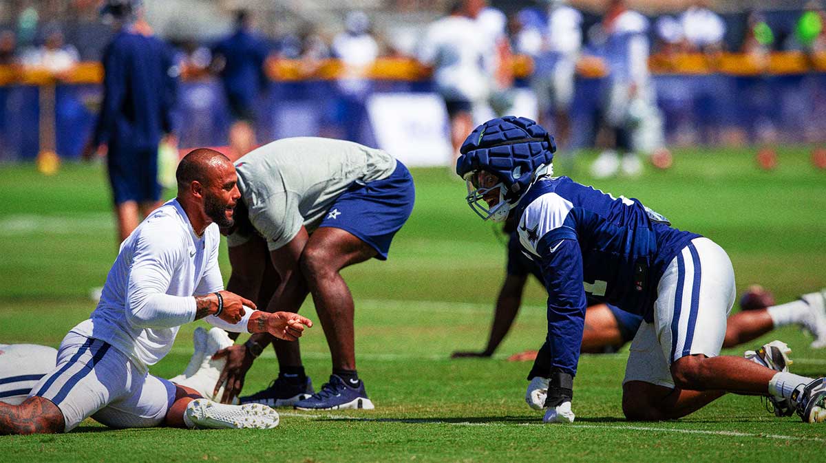 Dallas Cowboys quarterback Dak Prescott (4) and linebacker Micah Parsons (11) during training camp at Marriott Residence Inn-River Ridge playing fields.