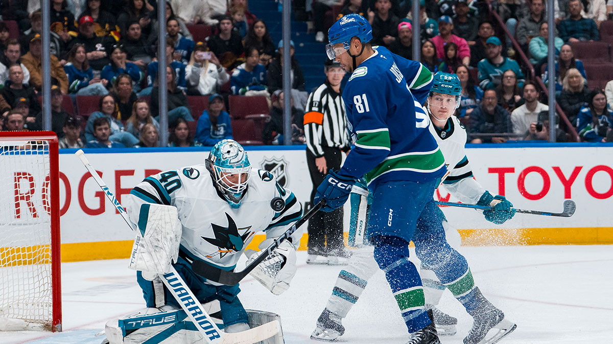 San Jose Sharks defenseman Jimmy Schuldt (59) watches as Vancouver Canucks forward Dakota Joshua (81) battles for the rebound with goalie Alexandar Georgiev (40) in the second period at Rogers Arena.