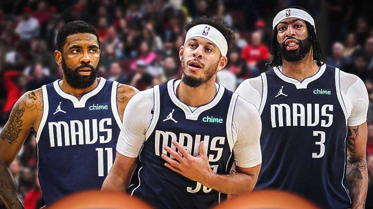 Seth Curry wearing a Dallas Mavericks jersey in the middle, Kyrie Irving and Anthony Davis around him