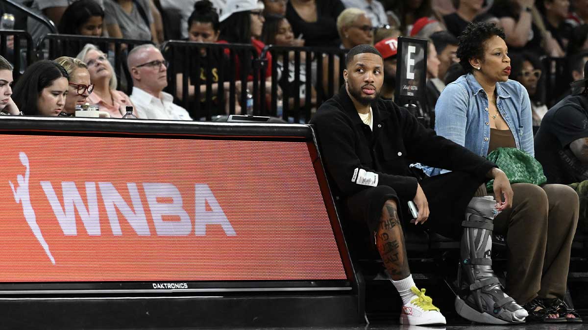 NBA player Damian Lillard sits courtside during the Las Vegas Aces and Los Angeles Sparks game at Michelob Ultra Arena.