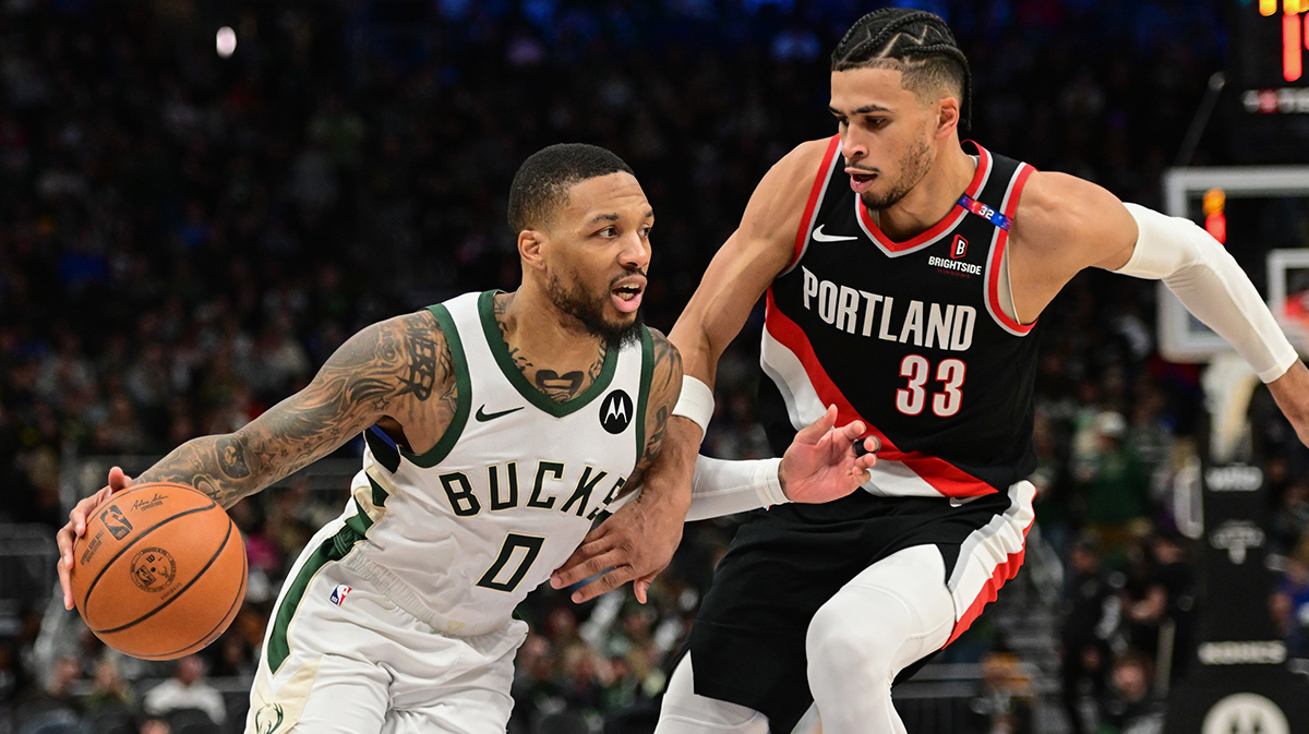 Milwaukee Bucks guard Damian Lillard (0) drives for the basket against Portland Trail Blazers forward Toumani Camara (33) in the third quarter at Fiserv Forum.