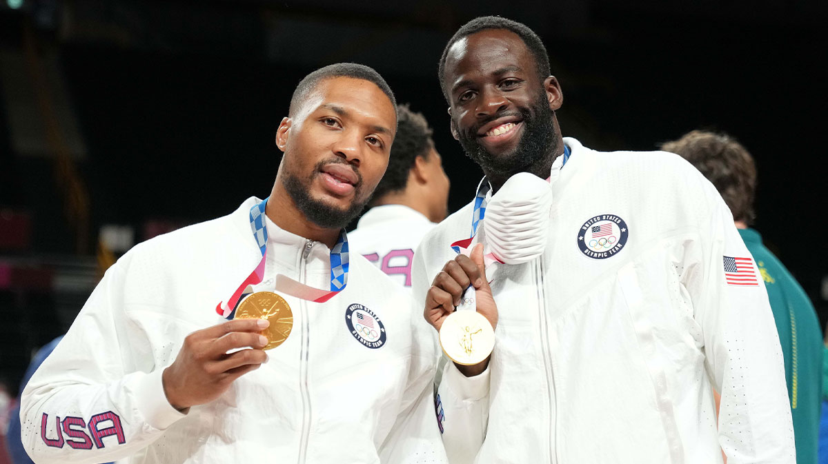 United States Damian Lillard (left) and United States Draymond Green (right) celebrate with their gold medals during the Tokyo 2020 Olympic Summer Games at Saitama Super Arena.