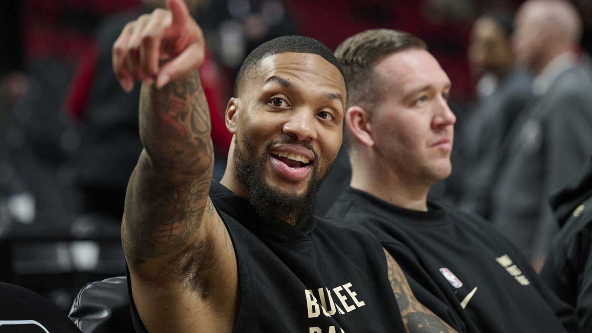 Milwaukee Bucks guard Damian Lillard (0) points to fans before a game against the Portland Trail Blazers at Moda Center.