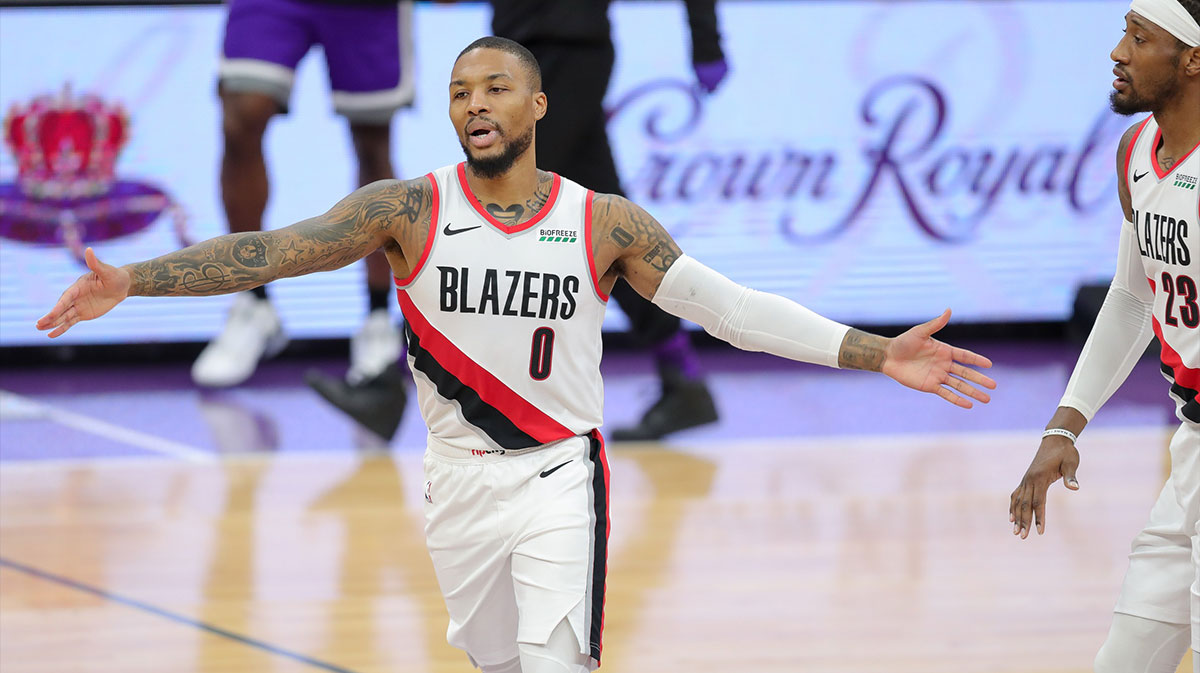Portland Trail Blazers guard Damian Lillard (0) celebrates with forward Robert Covington (23) during the second quarter against the Sacramento Kings at Golden 1 Center.