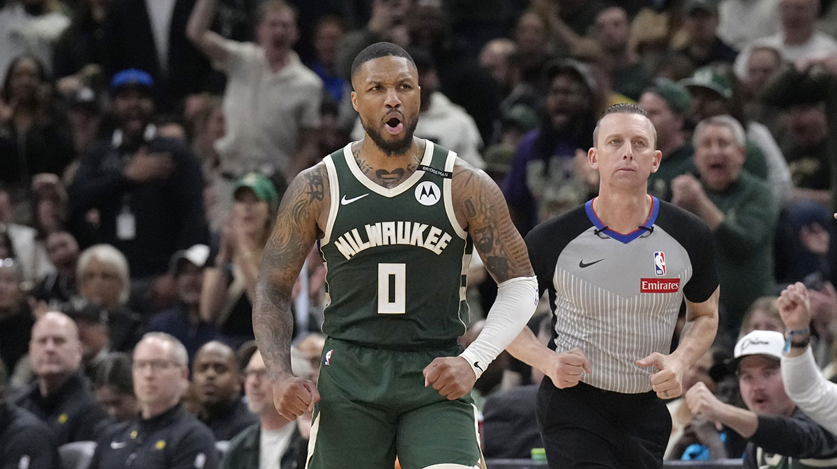 Milwaukee Bucks guard Damian Lillard (0) reacts after making a basket against the Indiana Pacers in the second half during game three of first round for the 2024 NBA Playoffs at Fiserv Forum.