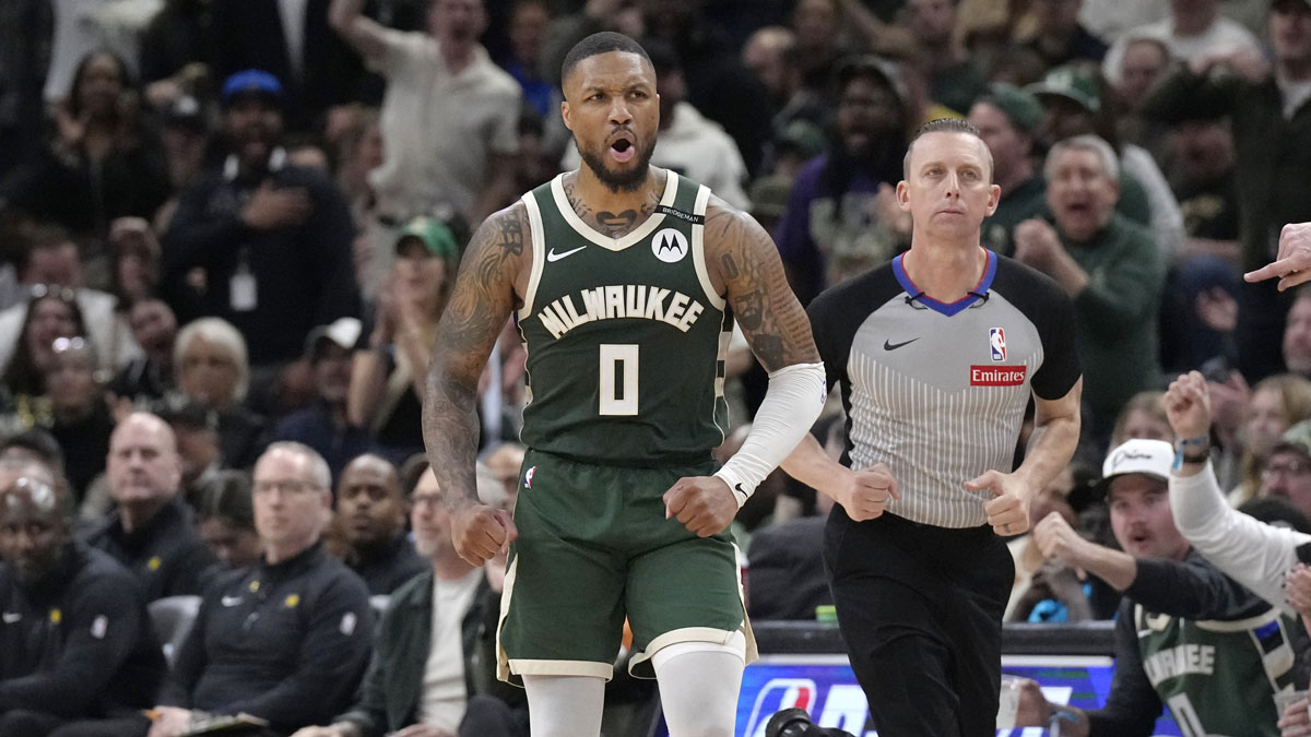 Milwaukee Bucks guard Damian Lillard (0) reacts after making a basket against the Indiana Pacers in the second half during game three of first round for the 2024 NBA Playoffs at Fiserv Forum.