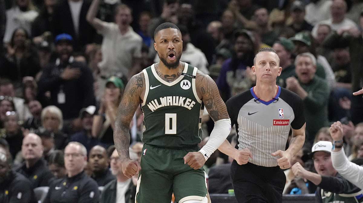 Milwaukee Bucks guard Damian Lillard (0) reacts after making a basket against the Indiana Pacers in the second half during game three of first round for the 2024 NBA Playoffs at Fiserv Forum.