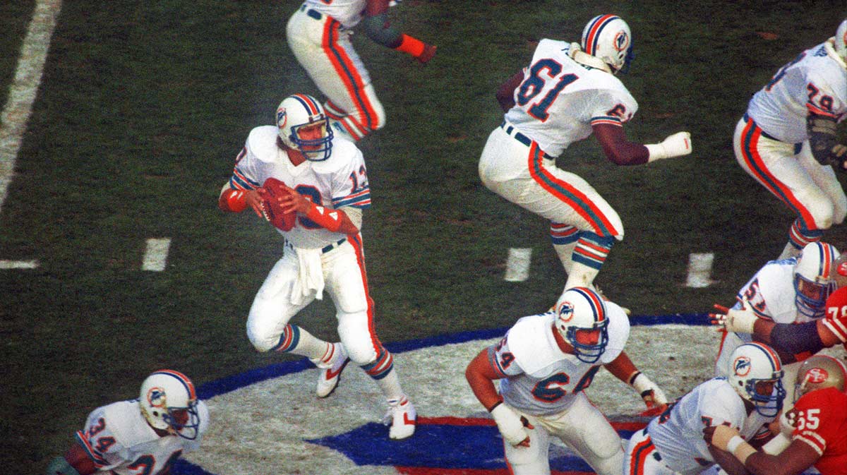 Miami Dolphins quarterback (13) Dan Marino drops to pass against the San Francisco 49ers during Super Bowl XIX at Stanford Stadium.The 49ers defeated the Dolphins 38-16.