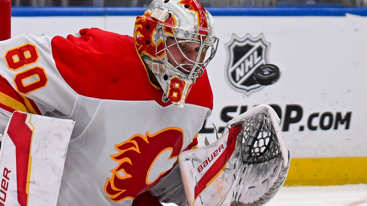 Calgary Flames goaltender Dan Vladar (80) makes a save against the New York Islanders during the second period at UBS Arena.