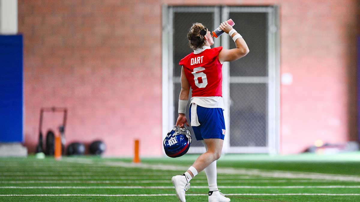 New York Giants quarterback Jaxson Dart (6) hydrates during minicamp at Quest Diagnostics Training Center.