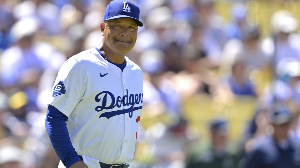 Jul 6, 2025; Los Angeles, California, USA; Los Angeles Dodgers manager Dave Roberts (30) walks to the mound for a pitching change in the eighth inning against the Houston Astros at Dodger Stadium. Mandatory Credit: Jayne Kamin-Oncea-Imagn Images