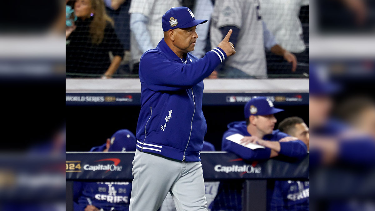 Los Angeles Dodgers manager Dave Roberts (30) makes a pitching change during the sixth inning against the New York Yankees in game five of the 2024 MLB World Series at Yankee Stadium.
