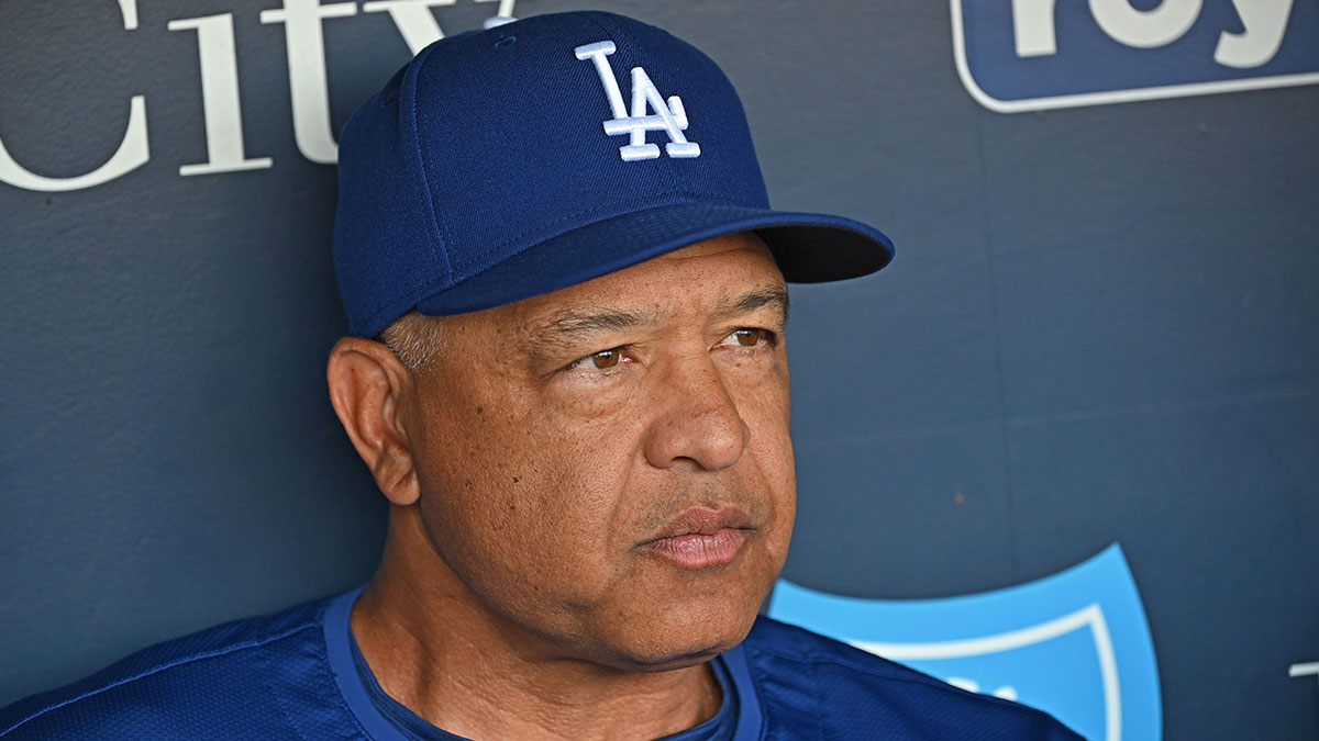 Los Angeles Dodgers manager Dave Roberts (30) talks with the media before a game against the Kansas City Royals at Kauffman Stadium.
