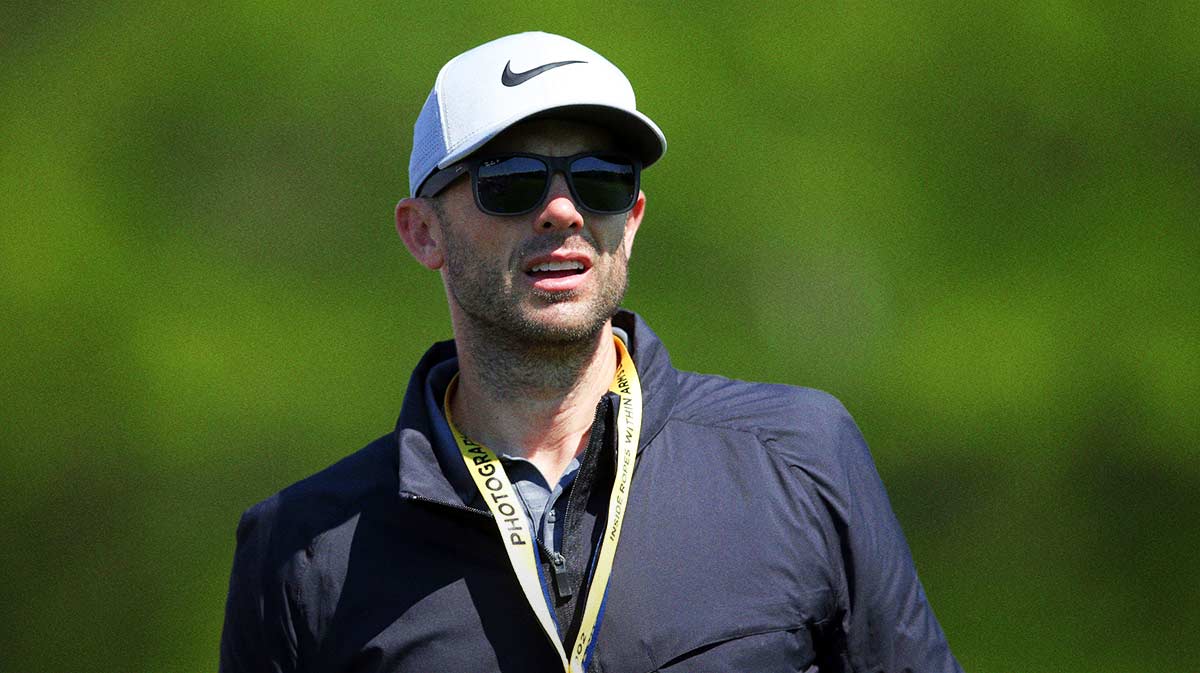 New York Mets former player David Wright walks with the Tiger Woods group during the first round of the PGA Championship golf tournament at Bethpage State Park.