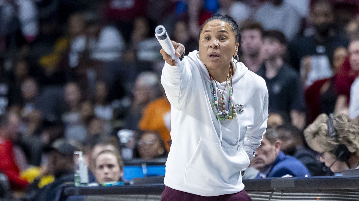 South Carolina Gamecocks head coach Dawn Staley signals to her team during the second half of an Elite 8 NCAA Tournament basketball game against the Duke Blue Devils at Legacy Arena.
