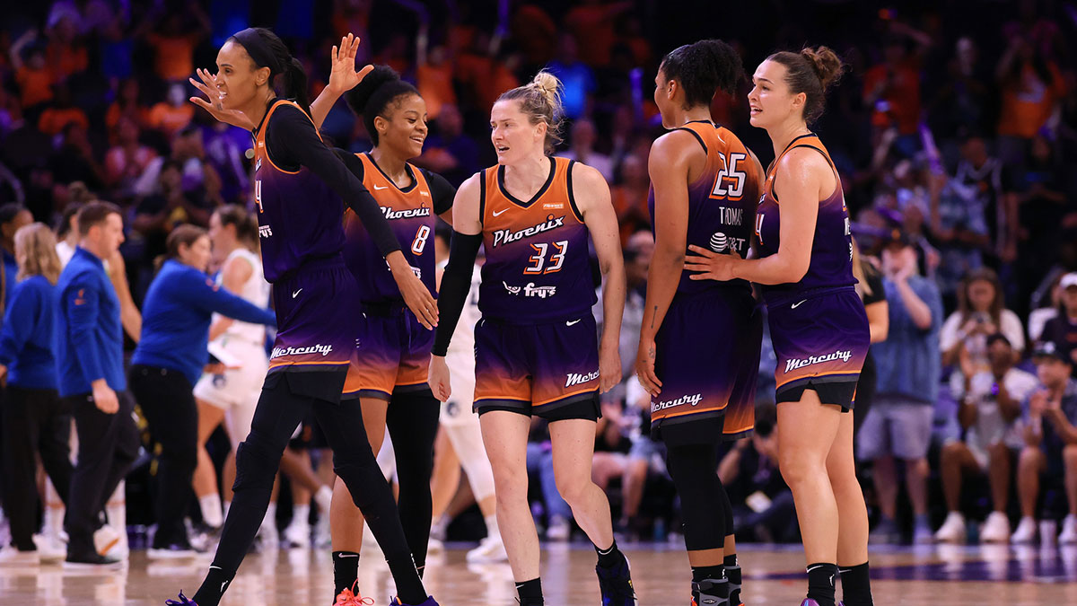 Phoenix Mercury forward Alyssa Thomas (25) celebrates with teammates Kathryn Westbeld (24), Sami Whitcomb (33), Monique Akoa Makani (8) and DeWanna Bonner (24) against the Minnesota Lynx during the second half at PHX Arena.