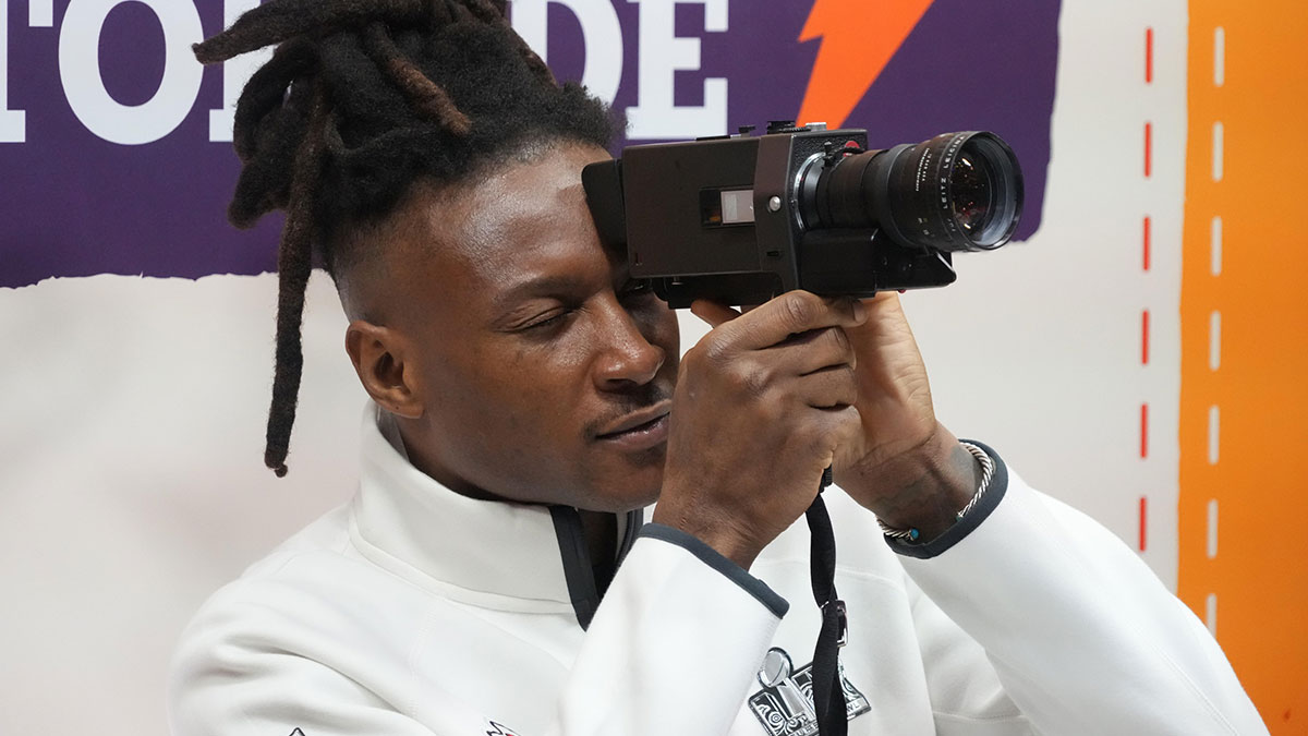Kansas City Chiefs wide receiver DeAndre Hopkins (8) looks through a video camera during Super Bowl LIX Opening Night at Ceasars Superdome.