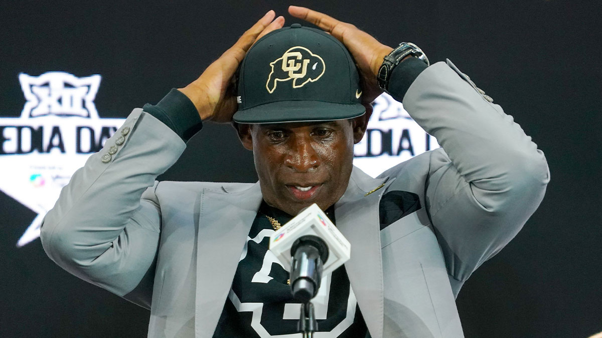 Colorado head coach Deion Sanders fixes his cap prior to speaking with the media during 2025 Big 12 Football Media Days at The Star.