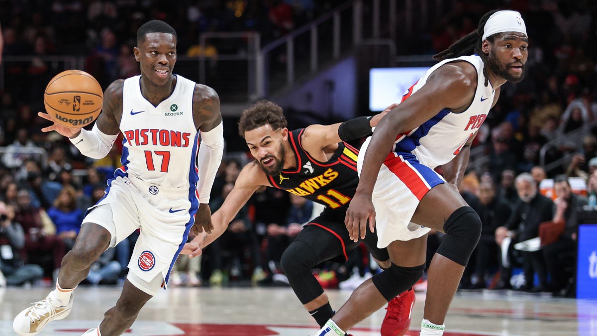 Detroit Pistons guard Dennis Schroder (17) and Detroit Pistons center Isaiah Stewart (28) run offensive screen against Atlanta Hawks guard Trae Young (11) during the first quarter at State Farm Arena.