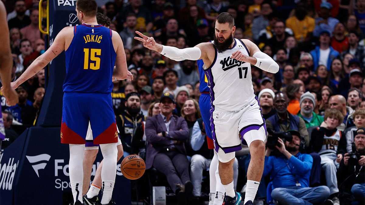 Sacramento Kings center Jonas Valanciunas (17) reacts after a play as Denver Nuggets center Nikola Jokic (15) looks on in the second quarter at Ball Arena.