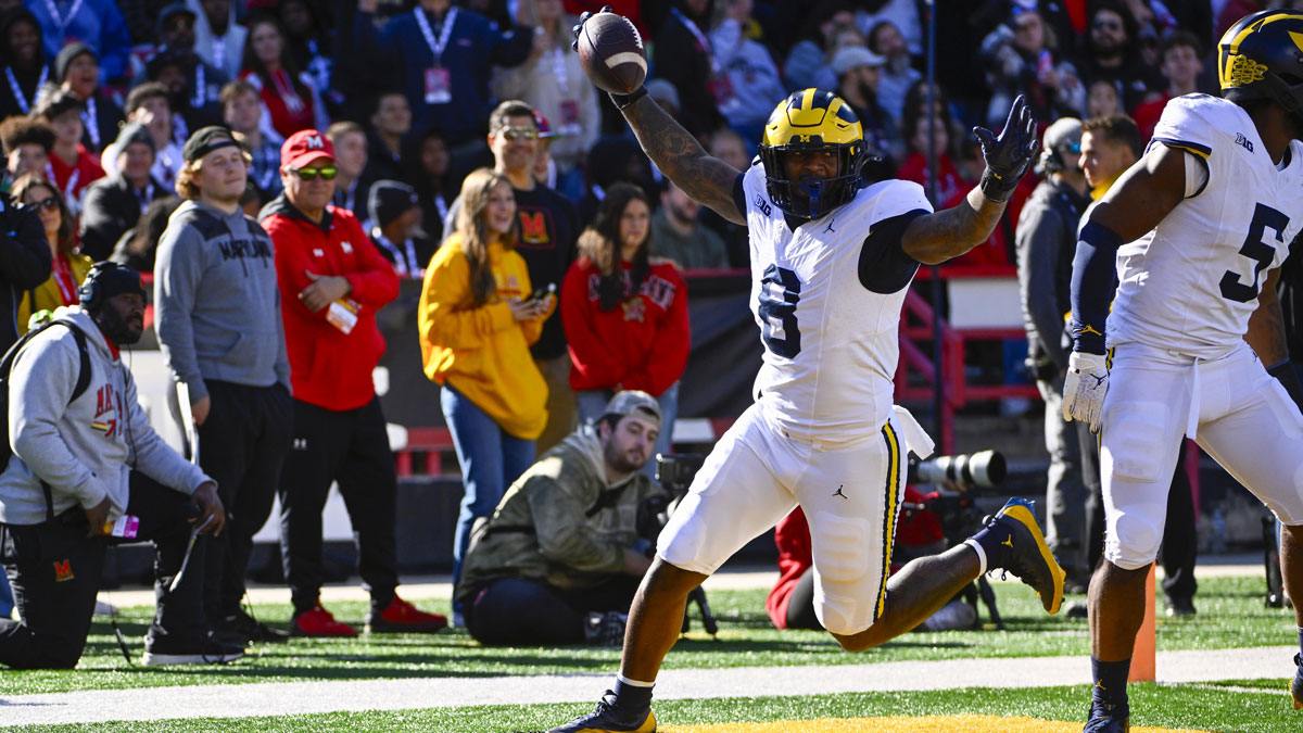 Michigan Wolverines defensive end Derrick Moore (8) celebrates after returning a fumble for a touchdown against the Maryland Terrapins during the first half at SECU Stadium.