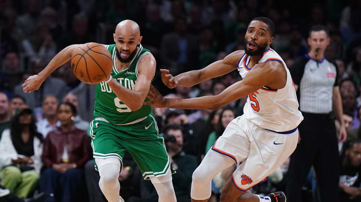 Boston Celtics guard Derrick White (9) and New York Knicks forward Mikal Bridges (25) work for the ball in the second quarter during game two of the second round for the 2025 NBA Playoffs at TD Garden.