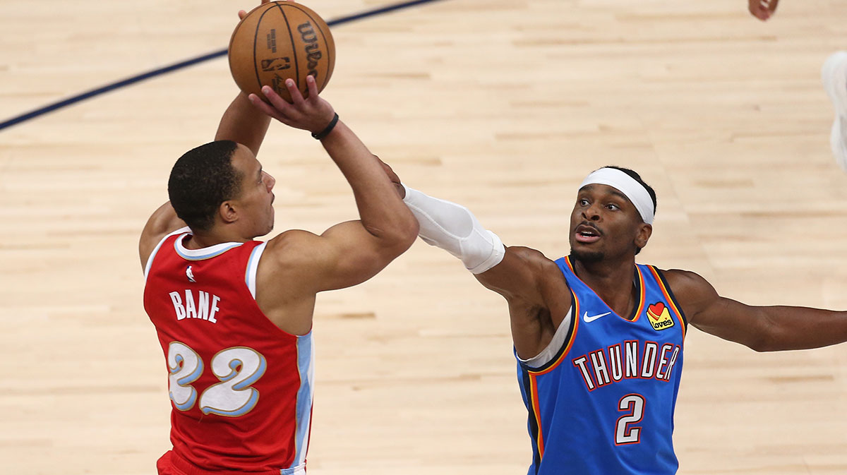 Memphis Grizzlies guard Desmond Bane (22) shoots as Oklahoma City Thunder guard Shai Gilgeous-Alexander (2) defends during the first quarter during game four for the first round of the 2024 NBA Playoffs at FedExForum.