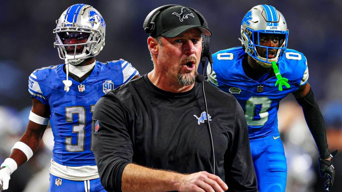 NFL Lions HC Dan Campbell (front, center) with Lions S Kerby Joseph and Lions CB Terrion Arnold behind him. Detroit Lions logo in background