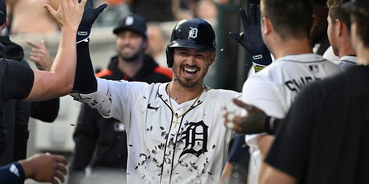 Detroit Tigers right fielder Zach McKinstry (39) gets showered with sunflower seeds as he celebrates in the dugout after hitting a home run against the Tampa Bay Rays in the seventh inning at Comerica Park.