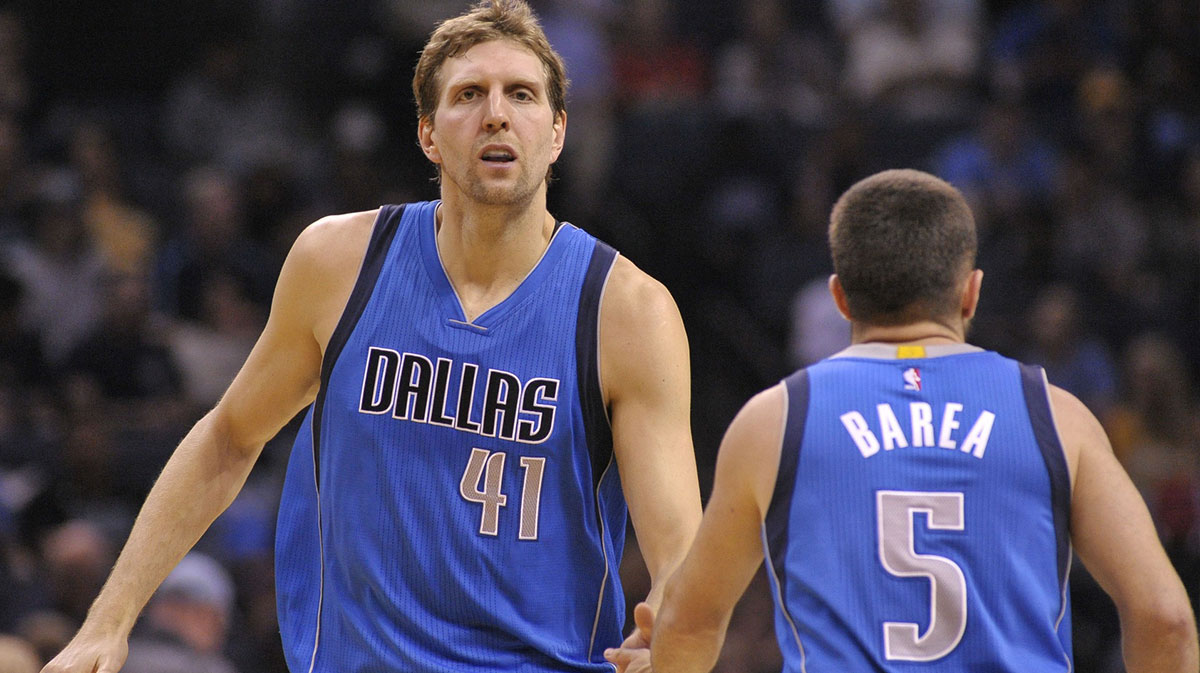 Dallas Mavericks forward Dirk Nowitzki (41) and guard J.J. Barea (5) react during the first half against the Memphis Grizzlies at FedExForum.