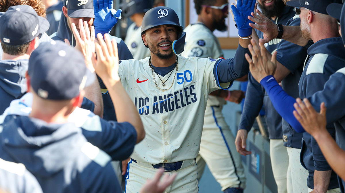 Los Angeles Dodgers shortstop Mookie Betts (50) is greeted in the dugout after hitting a solo homer during the first inning against the Houston Astros at Dodger Stadium. Mookie Betts was excluded from the MLB All-Star game this 2025 season.