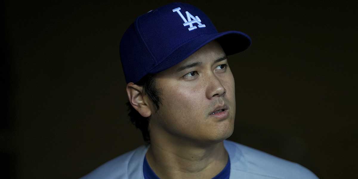 Los Angeles Dodgers designated hitter Shohei Ohtani (17) stands in the dugout before the game against the Cincinnati Reds at Great American Ball Park.